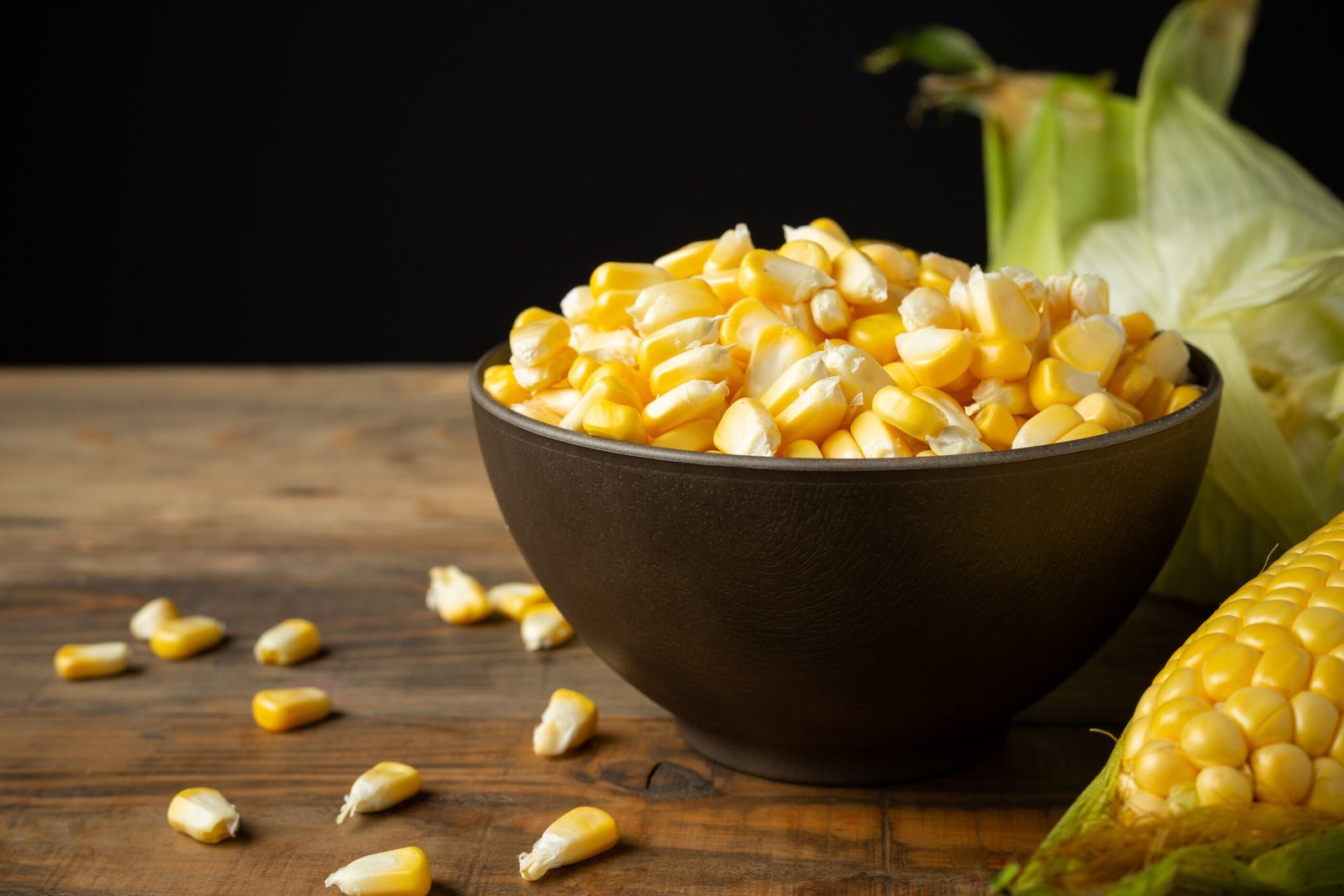 seeds sweet corn wooden table scaled.jpg